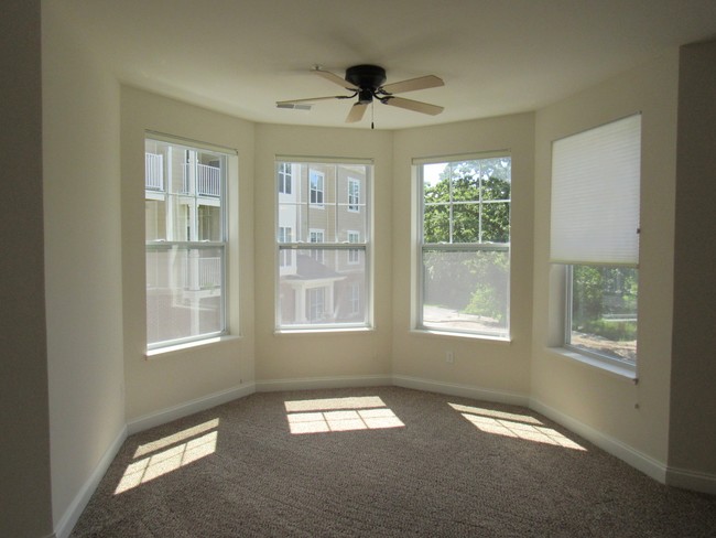 Turret windows in select units - Hartland Riverwalk Apartments