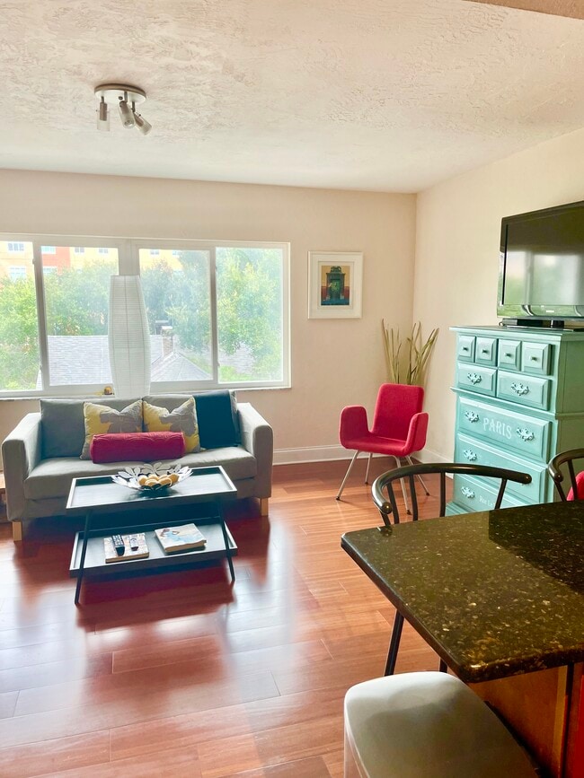 Bright pops of color throughout a naturally lit space - 210 5th Ave S