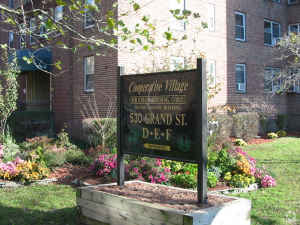 Sign outside the building - Amalgamated Dwellings