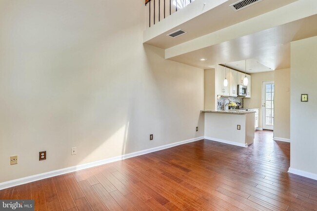 Living room with views to the kitchen - 1415 E Abingdon Dr