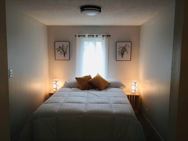 Bedroom with sliding glass barn doors - 223 10th Ave SE