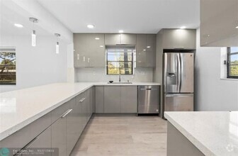 Building Photo - 6085 N Sabal Palm Blvd