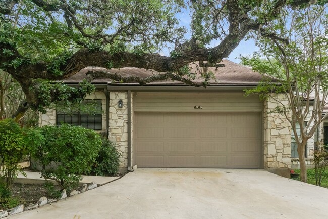 Building Photo - Charming 2-Bedroom Condo in Gated Community Surrounded by Mature Trees