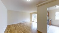 Located at 300 S Central Ave in Hartsdale, NY, this one-bedroom, one-bathroom residence offers a clean and functional single-floor layout designed for comfortable everyday living. The interior is finished with gleaming hardwood floors that run throughout, lending warmth and continuity to the space. Crisp white walls and flush ceiling lighting create a bright, neutral palette that is easy to personalize.

The living area is generously proportioned, offering ample room for a full furniture arrangement. A sliding glass door floods the space with natural light and provides direct access to an outdoor balcony, where views of surrounding greenery are visible — a welcoming feature that connects the interior to the outdoors. Baseboard heating runs along the perimeter of the room, ensuring reliable and even warmth throughout the cooler months.

Structural beam details near the ceiling add a subtle architectural character to the otherwise streamlined interior. The overall ambiance of the residence is calm and uncluttered, with an emphasis on light, open space, and practicality. Situated in the established Hartsdale neighborhood of Westchester County, this residence offers convenient access to local amenities, commuter transit, and the broader New York metropolitan area.