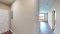 This 650 square foot apartment in King of Prussia, PA offers a thoughtful layout maximizing space and functionality. The single-floor design includes one bedroom, measuring 160 square feet, and one full bathroom. The heart of the home is an open-concept kitchen and living area, promoting a seamless flow for daily activities and entertaining.

The kitchen boasts modern amenities with stainless steel appliances, including a refrigerator, gas range, and built-in microwave. Warm wood cabinetry contrasts beautifully with the sleek white subway tile backsplash, while quartz countertops provide ample workspace. The living area features durable wood-look flooring and large windows that flood the space with natural light.

The bedroom offers plush carpeting for comfort and includes a ceiling fan for improved air circulation. A spacious closet with wire shelving provides generous storage. The bathroom showcases a contemporary vanity, modern fixtures, and a combination tub/shower.

Throughout the apartment, neutral wall colors create a versatile backdrop for various decor styles. Additional features include recessed lighting, window blinds for privacy, and a private balcony accessible through a glass door, offering outdoor space and views. This efficiently designed apartment combines style and practicality in a prime King of Prussia location.
