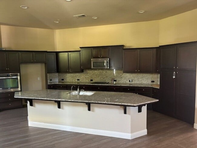 Building Photo - Elegant 4-Bedroom Home with Paid Solar in Gated Village Green Community