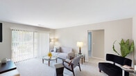 Located at 4235 N Bloomington Ave in Arlington Heights, IL, this single-floor residence offers a well-organized layout designed for comfortable everyday living. The living room serves as the heart of the space, featuring neutral-toned carpet, soft gray walls, and large sliding glass doors fitted with vertical blinds that invite abundant natural light and provide direct access to an outdoor patio with views of surrounding greenery.

The galley-style kitchen is well-appointed with warm wood cabinetry, granite countertops, stainless steel appliances including a refrigerator and gas range, and tile flooring. It opens conveniently into the adjacent dining area, which features carpet flooring and a ceiling fan, creating a practical flow for daily meals and entertaining.

The bedroom is generously proportioned with plush carpet, neutral walls, and a wide closet with built-in shelving. A dedicated flex room with a window and vertical blinds functions well as a home office or additional living space. The bathroom includes a full tub-shower combination with tile surround. Throughout, the space maintains a cohesive, understated aesthetic with neutral tones and functional design elements.