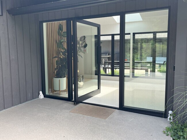 Building Photo - Sleek, Stylish & Surrounded by Green – The...