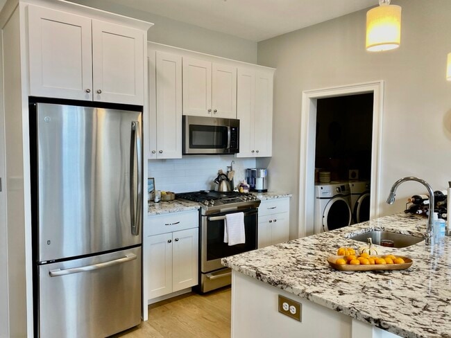 kitchen and laundry room - 77 Van Dam St