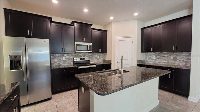 Foto del edificio - 9881 Magnolia Woods Blvd