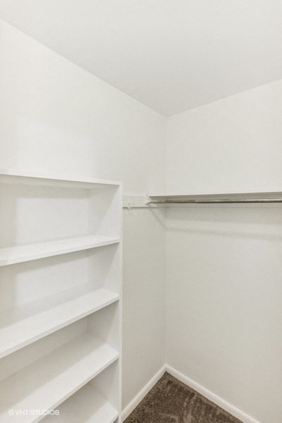 Oversized Primary Closet with Built in Shelves - The Pentacle Group Apartments