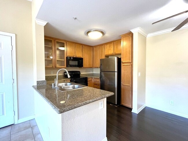 Building Photo - 1BR Condo with Private Balcony, Central A/C & Community Amenities in Corona