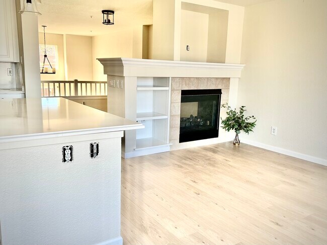 Updated living room on the kitchen/ balcony level with gas fireplace. - 623 Tantra Dr