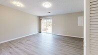 This 850 square foot residence in Lynchburg, VA offers a thoughtful layout across two floors. The ground floor, spanning 450 sq ft, houses a bright, modern kitchen with white cabinetry and stainless steel appliances. Large windows in the living areas flood the space with natural light, offering views of the surrounding wooded landscape.

The home features a harmonious blend of flooring materials, with sleek hardwood in the main living areas and plush carpeting in the bedrooms. The primary bedroom, measuring 180 sq ft, provides ample space and storage. A well-appointed bathroom with a tub-shower combination and single vanity serves the home's occupants.

Additional features include a utility room for laundry and storage, a hallway for easy navigation between rooms, and two closets for organization. The property's exterior showcases a wooded backdrop, offering privacy and a connection to nature.

With its efficient use of space, modern amenities, and tranquil setting, this Lynchburg home presents a comfortable and functional living environment. The combination of open living areas and private spaces makes it suitable for various lifestyle needs.
