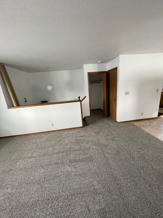 Living room, closet and door closed is laundry room - 167 Harmony St S
