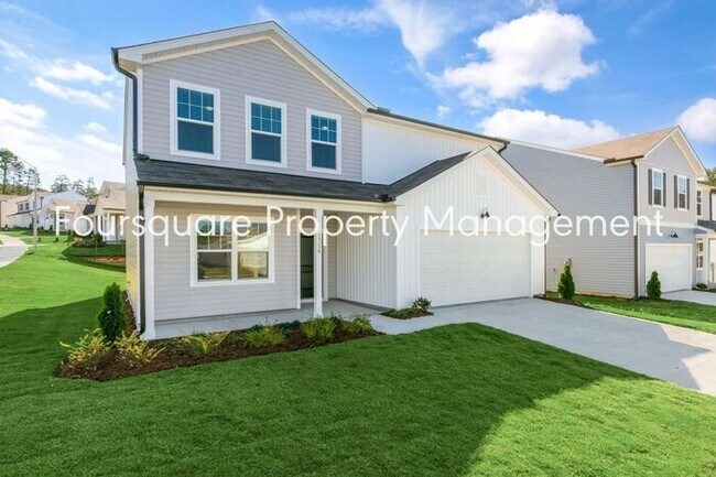 Foto del edificio - 4 Bedroom Home with 2nd Floor Loft- Kitchen Island & 2-Car Garage – Convenient Raleigh Location