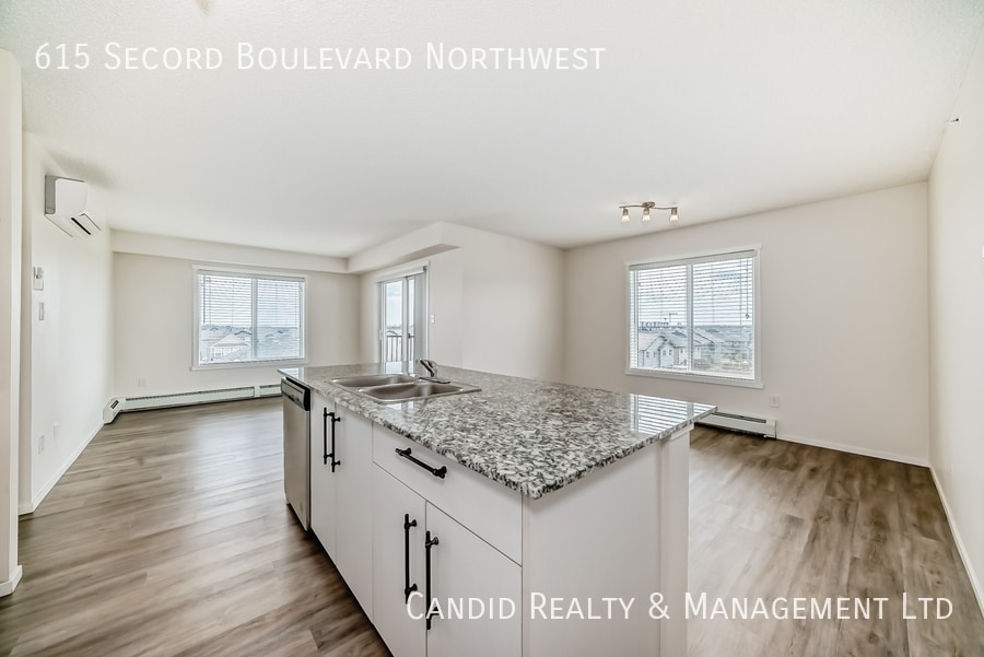 Building Photo - Modern 2 Bed, 2 Bath Condo with Undergroun...