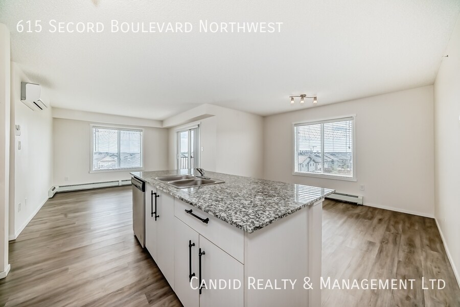Photo du bâtiment - Modern 2 Bed, 2 Bath Condo with Undergroun...