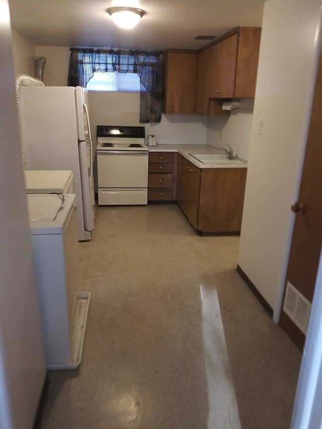 Looking into Kitchen. Washer/dryer on left - 56 S 600 E