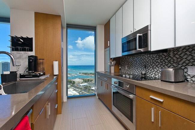 Fully stocked kitchen with silverware, dishes, cookware, toaster, coffeemaker and stainless steel ap - 600 Ala Moana Blvd