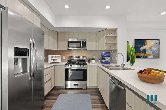 Open-Concept Kitchen with Stainless-Steel Appliances - Colby Missouri by Wiseman
