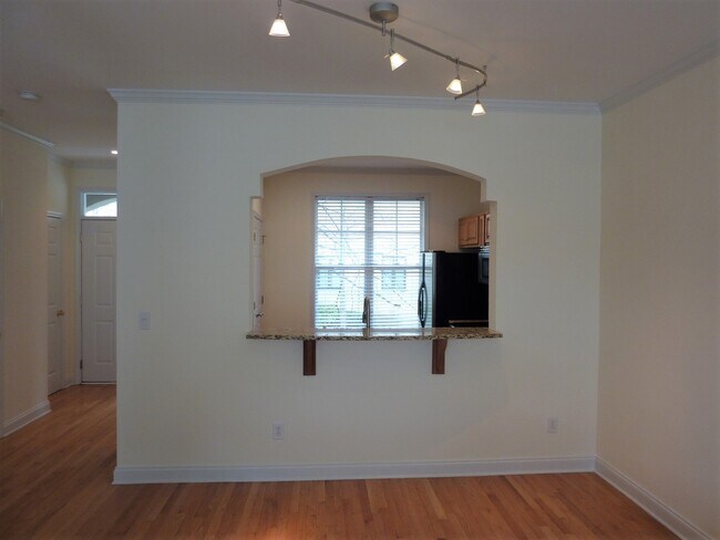 Opening between Kitchen & Dining Area - 212 S Cedar St