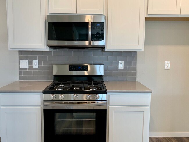 Building Photo - BUILT IN 2021 4 BEDROOM HOME LOCATED in th...