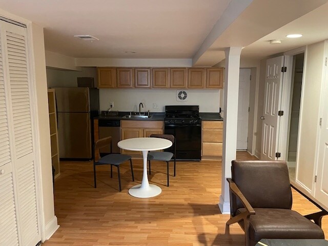 Looking from sleeping area toward kitchen. - 1126 8th St NE