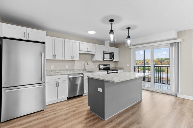 Second-floor units feature private balconies directly off the kitchen  perfect for morning coffee or evening unwinding. - The Parker