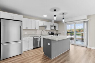 Second-floor units feature private balconies directly off the kitchen  perfect for morning coffee or evening unwinding. - The Parker
