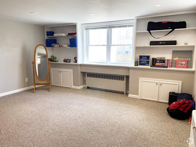 Den with ample sunlight and bookshelves - 110 Dobson St