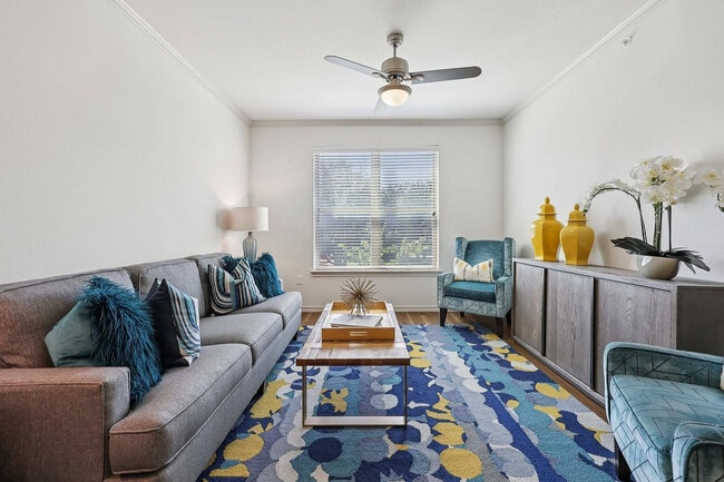 A bright and inviting living room designed for comfort at McDermott 55. - McDermott 55