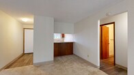 This 770 square foot apartment offers a thoughtful layout with two bedrooms and two bathrooms. The primary bedroom, measuring 150 square feet, provides ample space for a restful retreat. The living area is the heart of the home, featuring a cozy fireplace and sliding glass doors that lead to a balcony, allowing natural light to flood the space.

The kitchen, while compact, is efficiently designed with modern appliances, including a refrigerator and electric stove. Wood cabinetry provides storage, and the linear layout optimizes the available space. The bathrooms are well-appointed, with one featuring a shower-tub combination and the other a vanity with wooden cabinets and a large mirror.

Throughout the apartment, neutral-toned carpeting creates a warm ambiance, while the kitchen and bathroom showcase durable flooring. The bedrooms are spacious, with large windows offering views of the surrounding greenery. Built-in closets with mirrored sliding doors maximize storage and create an illusion of more space.

The overall design emphasizes functionality and comfort, making efficient use of the 770 square feet. Located in Fairview Heights, IL, this apartment combines suburban tranquility with urban convenience, ideal for those seeking a cozy yet practical living space.