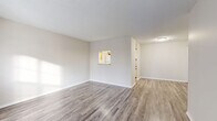 Located at 3613 SE 30th Ter in Topeka, KS, this single-floor, 2-bedroom, 1-bathroom home offers a clean, modern aesthetic throughout. The layout is thoughtfully organized, connecting a bright living room to a dedicated dining area and an adjoining kitchen-living space. The living room features large windows that invite natural light and offer views of the surrounding neighborhood, complemented by wood-look luxury vinyl plank flooring and a textured ceiling. The galley-style kitchen is efficiently designed with ample cabinetry featuring wood-trimmed doors, light countertops, a double sink, and white appliances including a range and refrigerator. The primary bedroom is a comfortable size with its own dedicated closet and easy access to the hallway. The second bedroom also features LVP flooring, a window for natural light, and a closet with sliding doors. The bathroom is clean and functional, finished with matching LVP flooring and light-toned walls. A notable feature of this home is the abundance of closet space, with four closets total — including a generously sized walk-in closet fitted with wire shelving. A utility room and hallway complete the practical, well-organized floor plan.