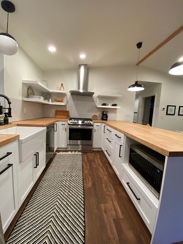 Full kitchen with stainless steel appliances - 1238 NE Jones Rd