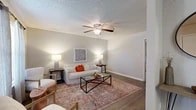 Located at 9045 Kingston Rd in Shreveport, Louisiana, this single-floor residence offers a thoughtfully organized layout comprising one bedroom, two bathrooms, a living room, dining room, kitchen, pantry, and three closets. The living room is bright and welcoming, featuring wood-look flooring, a textured ceiling, and a ceiling fan with light fixture. Natural light filters through windows dressed with sheer curtains, creating a warm and comfortable atmosphere. A dedicated dining area sits adjacent to the living space, highlighted by a window with soft drapery that brings in additional natural light. The galley-style kitchen is efficiently designed with gray cabinetry, dark granite-style countertops, a double sink, and black appliances including a range, microwave, and refrigerator, all set over light wood-look flooring. The bedroom is a cozy retreat with its own ceiling fan, wood-look flooring, and a window for natural light. The two bathrooms are functional and clean — one features a vanity with gray cabinetry and dark countertop, while the other includes a tiled tub-shower combination. Ample closet space and a pantry add to the practical appeal of this well-maintained residence.