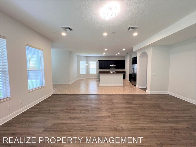 Building Photo - 6 br, 5 bath House - 7121 Blue Indigo Cres