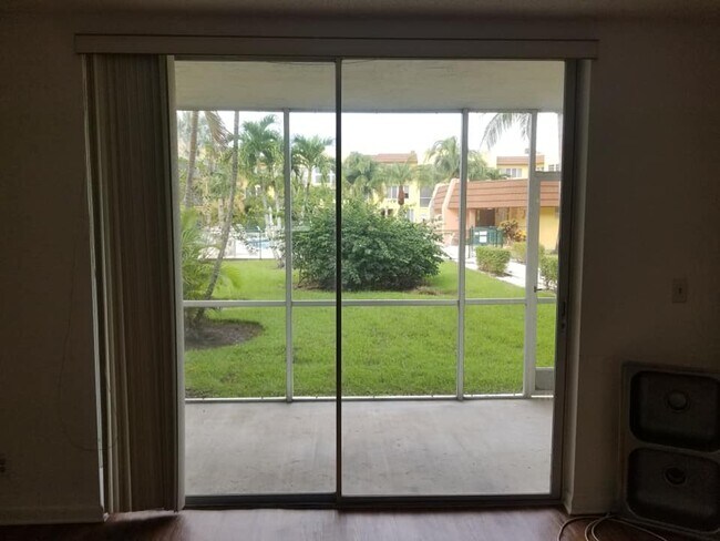View through Screened Patio to Pool - 6700 Royal Palm Blvd