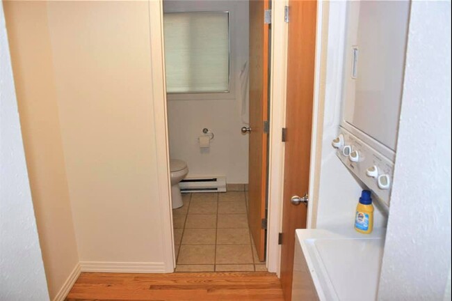 Stackable washer/dryer, large closet, and view into bathroom - 1228 Maple Street