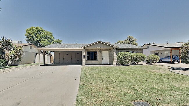 Front of the home on a beautiful, quiet, newly repaved street. - 130 E Harvard Dr