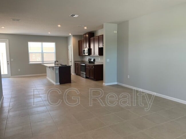 Building Photo - 6013 Blue Lily Wy