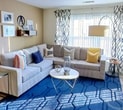 Welcome to your new beginning at 150 Southfield Ave, where aspirations become reality. This stunning 640 sq ft apartment is more than just a home; it's a canvas for your dreams and a launchpad for your ambitions. As you step into the living room, you're greeted by a flood of natural light streaming through large windows, creating an atmosphere of openness and possibility. The sleek, contemporary design with its clean lines and neutral palette serves as the perfect backdrop for your personal style.

The heart of this urban oasis is the living area, where a plush sectional invites you to unwind after a day of conquering the world. Imagine hosting friends for movie nights or quiet evenings of reflection as you gaze out at the Stamford skyline. The adjacent dining space transitions seamlessly, ideal for intimate dinners or impromptu work sessions.

The bedroom is a serene retreat, boasting 140 sq ft of pure comfort. With ample closet space and room for a home office nook, it's designed to support your multifaceted lifestyle. Wake up to soft morning light filtering through designer curtains, feeling refreshed and ready to seize the day.

In the kitchen, culinary enthusiasts will delight in the modern appliances and thoughtful layout. Whether you're preparing a gourmet meal or grabbing a quick breakfast, this space is equipped to handle it all with style and efficiency.

Throughout the apartment, carefully chosen details like the striking blue area rug and artful wall decorations add personality and warmth. The wood-look flooring not only enhances the contemporary aesthetic but also provides durability for your active lifestyle.

This isn't just an apartment; it's a statement of who you are and who you aspire to be. Located in the heart of Stamford, you're perfectly positioned to take advantage of all the city has to offer while having a tranquil home base to return to. Your journey to a life of style, comfort, and achievement starts here. Welcome home.