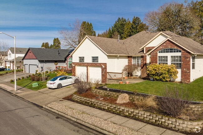 Homes in Kelly Creek have well-maintained lawns.