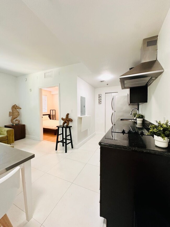 Building Photo - Bright and furnished 1/1 in classy remodel...