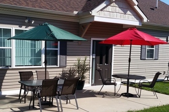 Back patio area. Propane grill, Tables & Chairs available for use. - Sheridan Park and Holiday Manor