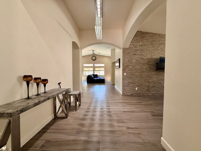 Building Photo - Welcome to this stunning 5-bedroom, 3-bath home located in the desirable Estates of Wigwam Ranch ...