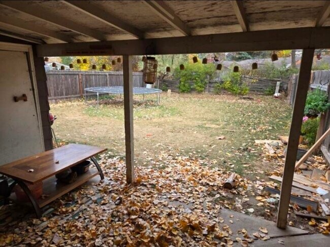 back yard with covered patio - 1104 Castlerock Dr