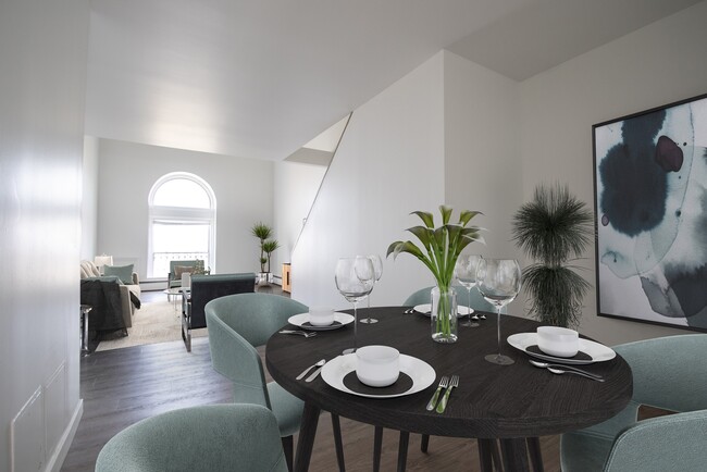 Step into the allure of this timeless apartment building, where a spacious dining room awaits - The Taft