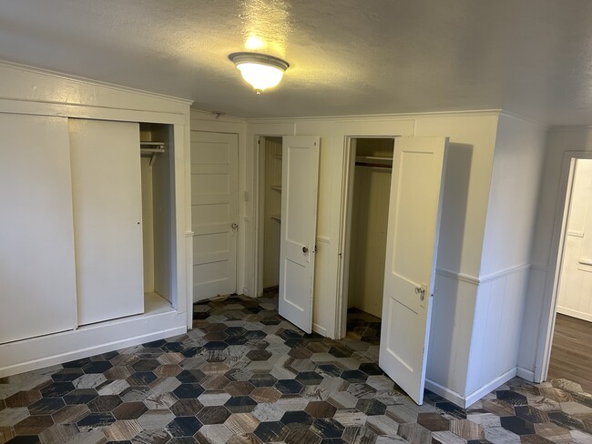 Larger bedroom has 3 closets and attached bathroom - 4510 Dunsmuir Ave