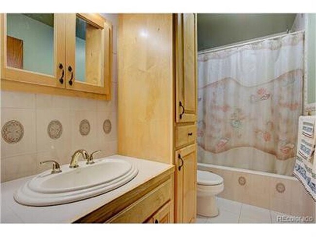 Building Photo - Updated clean and colorful 4 bed 2 bath ranch with a 2-Car garage!